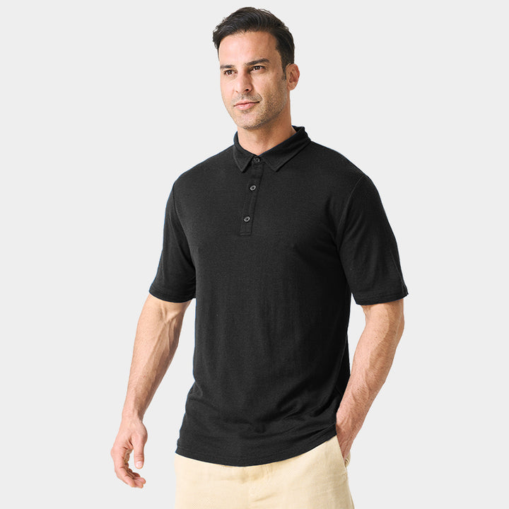 Male model wearing white merino wool polo shirt, featuring flexible fit, short sleeves, three-button placket, and stand-up collar for sun protection.
