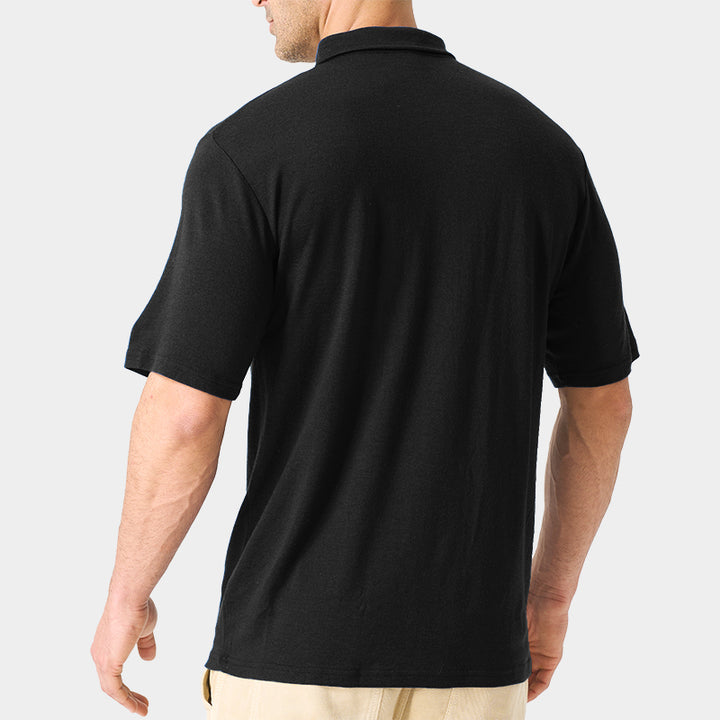 Male model wearing white merino wool polo shirt, featuring flexible fit, short sleeves, three-button placket, and stand-up collar for sun protection.
