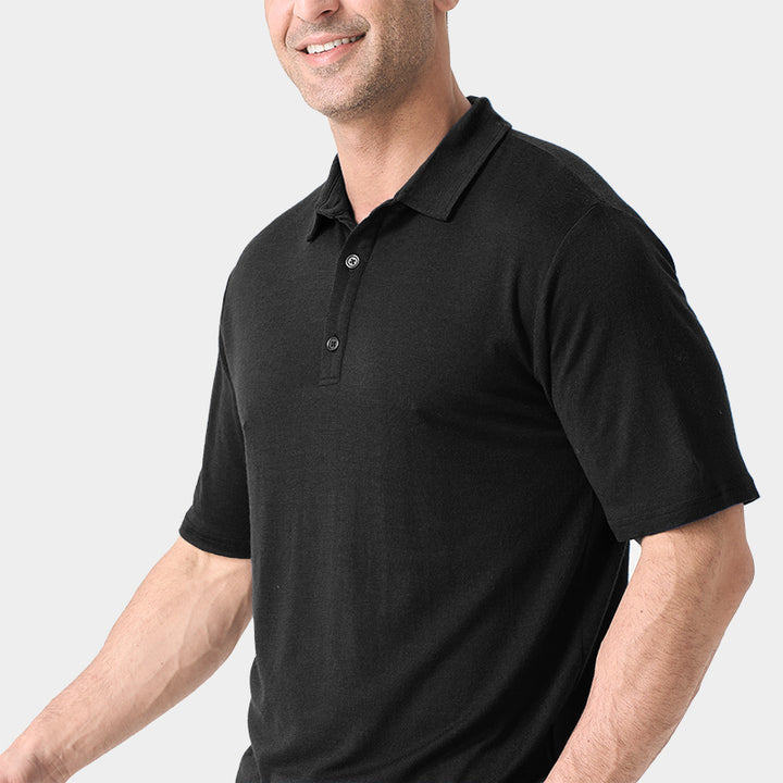 Male model wearing white merino wool polo shirt, featuring flexible fit, short sleeves, three-button placket, and stand-up collar for sun protection.
