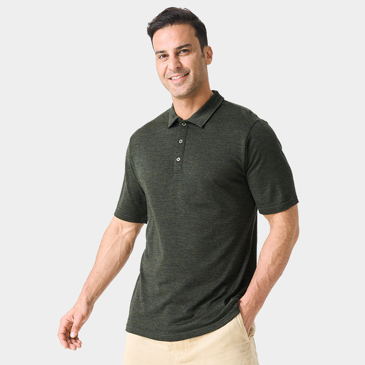 Male model wearing white merino wool polo shirt, featuring flexible fit, short sleeves, three-button placket, and stand-up collar for sun protection.
