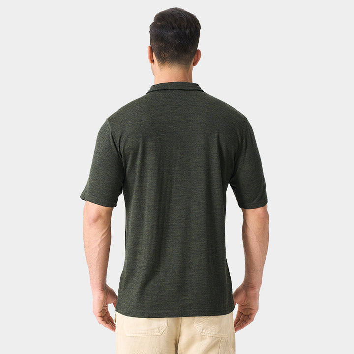 Male model wearing white merino wool polo shirt, featuring flexible fit, short sleeves, three-button placket, and stand-up collar for sun protection.
