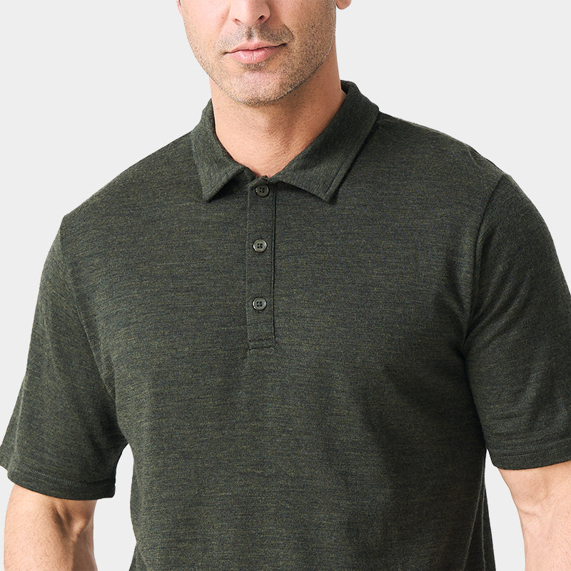 Male model wearing white merino wool polo shirt, featuring flexible fit, short sleeves, three-button placket, and stand-up collar for sun protection.
