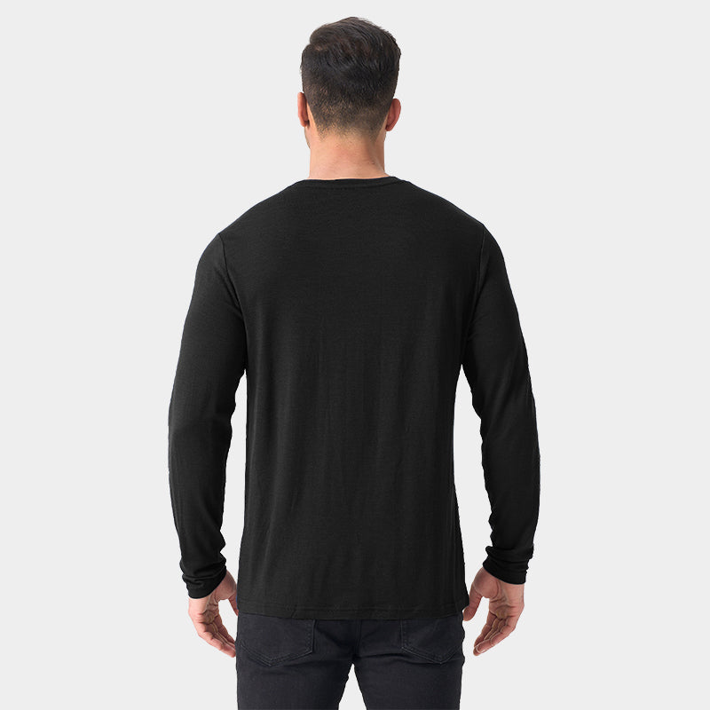 Male model wearing a lightweight Merino wool long sleeve crew base layer top, breathable and comfortable, shown in black.