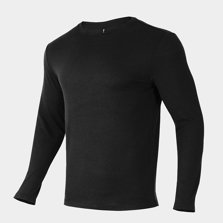 Male model wearing a lightweight Merino wool long sleeve crew base layer top, breathable and comfortable, shown in black.