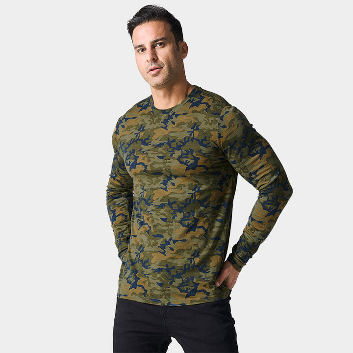 Male model wearing a lightweight Merino wool long sleeve crew base layer top, breathable and comfortable, shown in Camo.