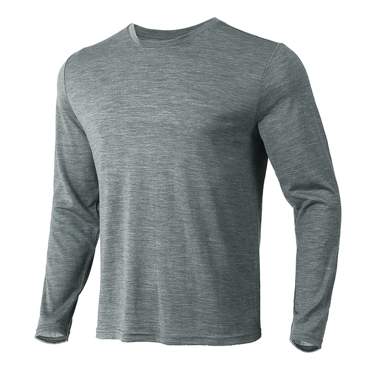 Male model wearing a lightweight Merino wool long sleeve crew base layer top, breathable and comfortable, shown in grey heather.