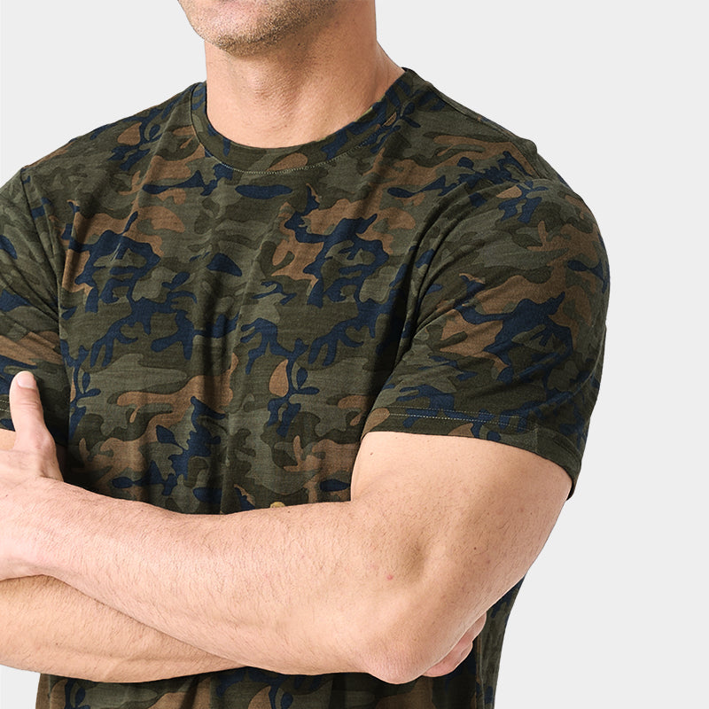 Male model wearing a lightweight Merino wool short sleeve crew t-shirt, breathable and moisture-wicking, shown in camo.