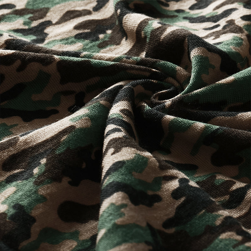 Male model wearing a lightweight Merino wool short sleeve crew t-shirt, breathable and moisture-wicking, shown in camouflage.