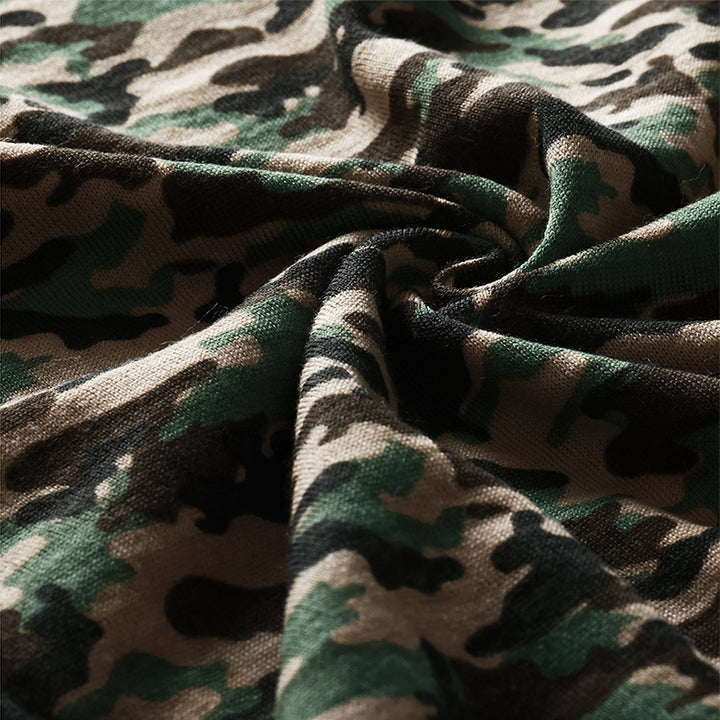 Male model wearing a lightweight Merino wool short sleeve crew t-shirt, breathable and moisture-wicking, shown in camouflage.