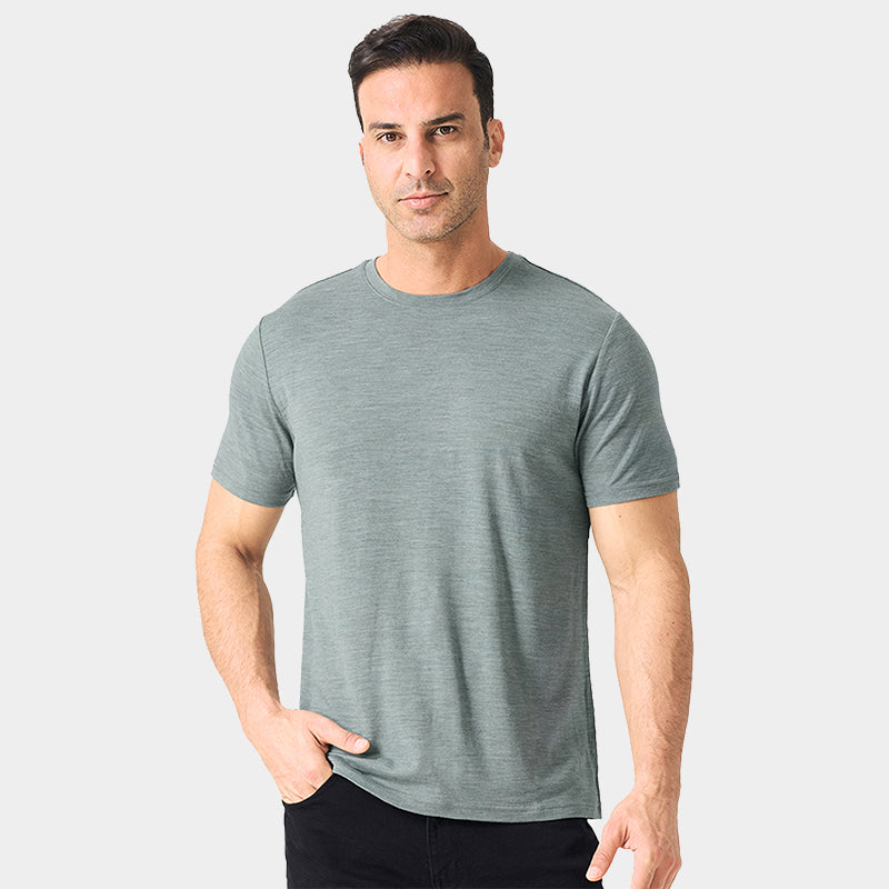 Male model wearing a lightweight Merino wool short sleeve crew t-shirt, breathable and moisture-wicking, shown in grey.