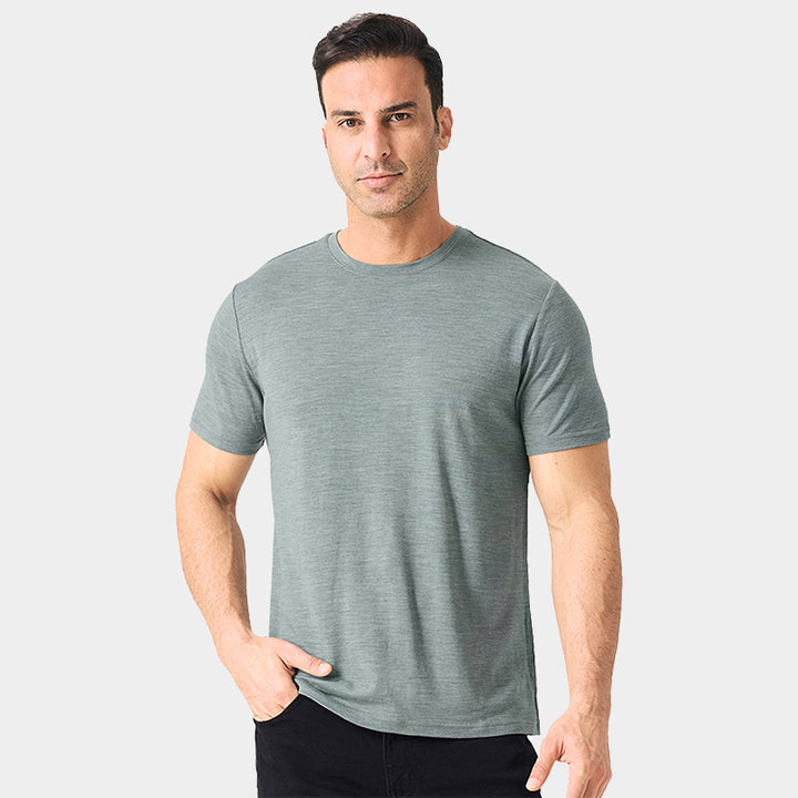 Male model wearing a lightweight Merino wool short sleeve crew t-shirt, breathable and moisture-wicking, shown in grey.
