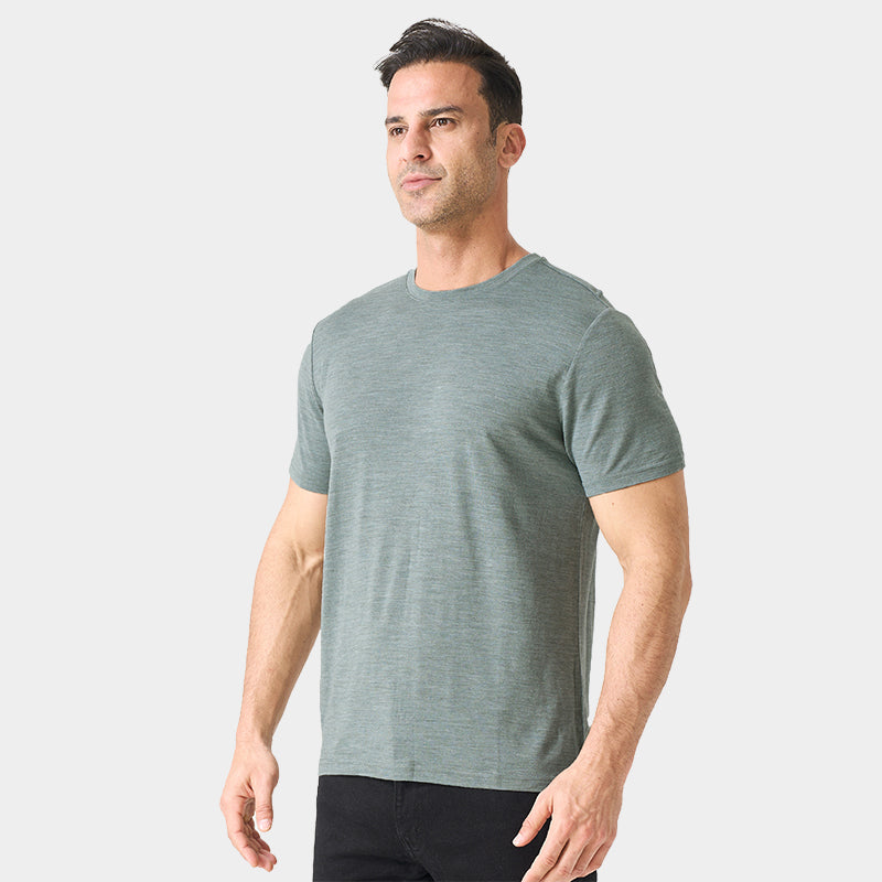 Male model wearing a lightweight Merino wool short sleeve crew t-shirt, breathable and moisture-wicking, shown in grey.