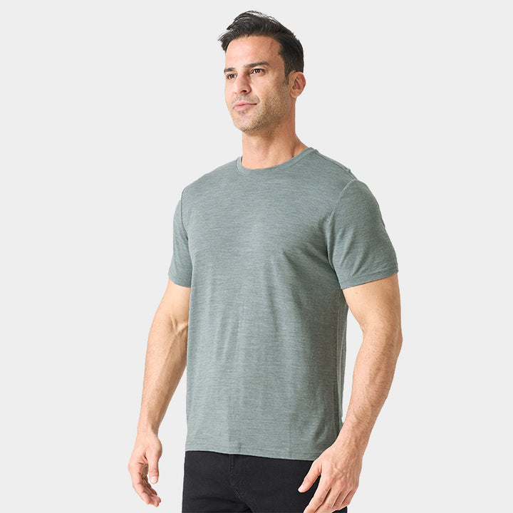 Male model wearing a lightweight Merino wool short sleeve crew t-shirt, breathable and moisture-wicking, shown in grey.