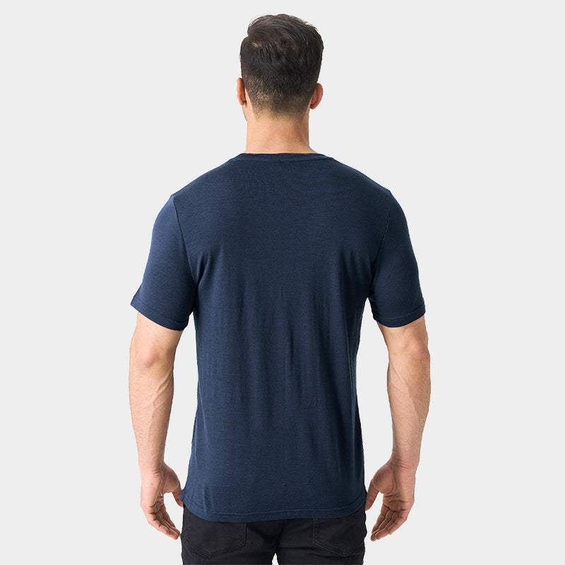 Male model wearing a lightweight Merino wool short sleeve crew t-shirt, breathable and moisture-wicking, shown in navy.