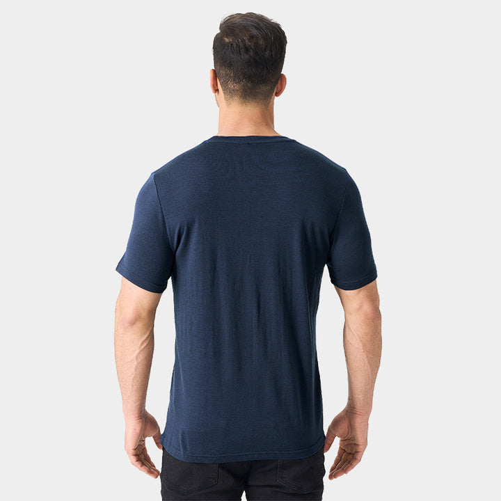 Male model wearing a lightweight Merino wool short sleeve crew t-shirt, breathable and moisture-wicking, shown in navy.