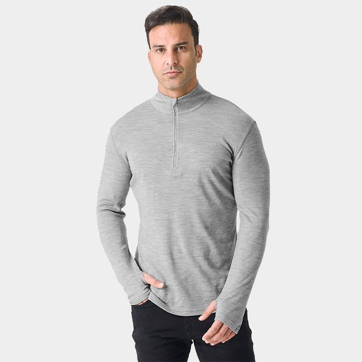 Male model wearing Light Grey Heather Men’s 250g Merino wool long sleeve half zip top, breathable and moisture-wicking for warmth and outdoor comfort.