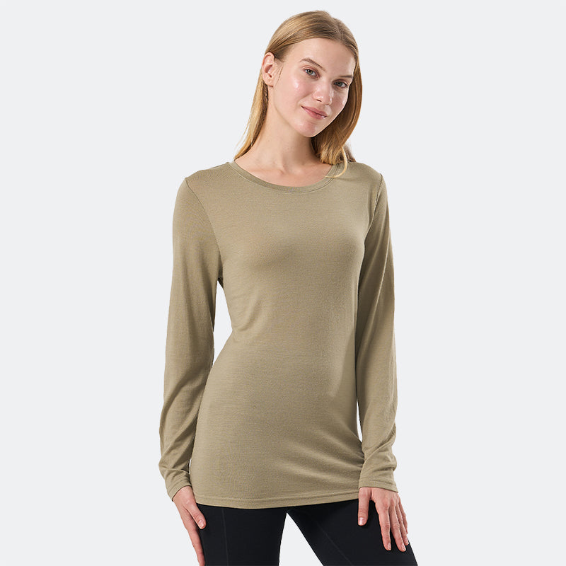 Famel model wearing a lightweight Merino wool long sleeve crew base layer top, breathable and comfortable, shown in dark olive.