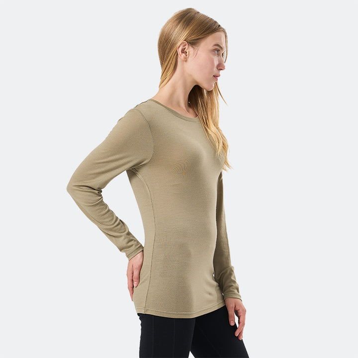 Famel model wearing a lightweight Merino wool long sleeve crew base layer top, breathable and comfortable, shown in dark olive.