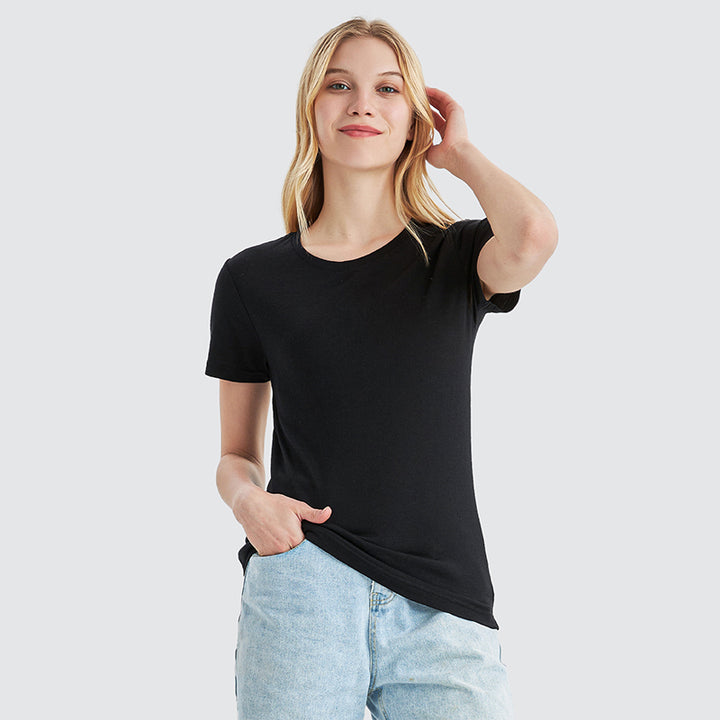 Famel model wearing a lightweight Merino wool short sleeve crew t-shirt, breathable and comfortable, shown in black.