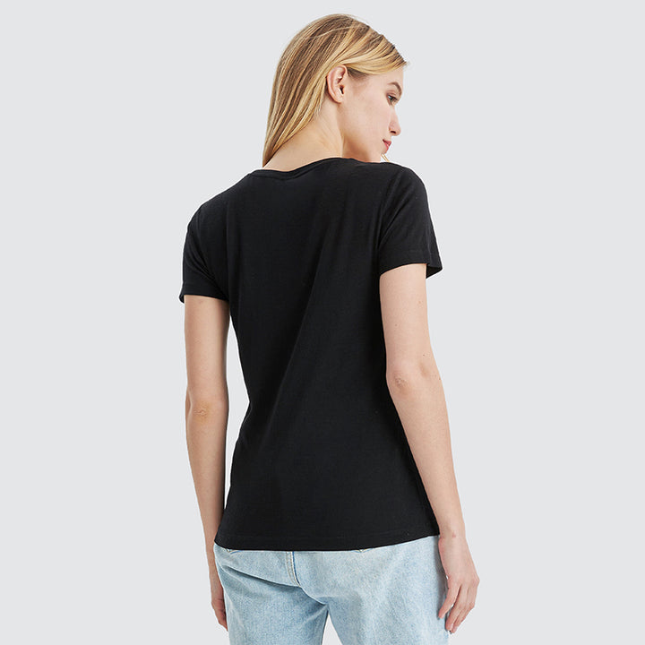 Famel model wearing a lightweight Merino wool short sleeve crew t-shirt, breathable and comfortable, shown in black.