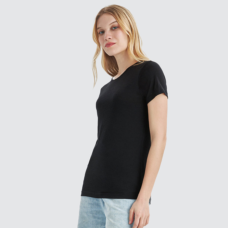 Famel model wearing a lightweight Merino wool short sleeve crew t-shirt, breathable and comfortable, shown in black.