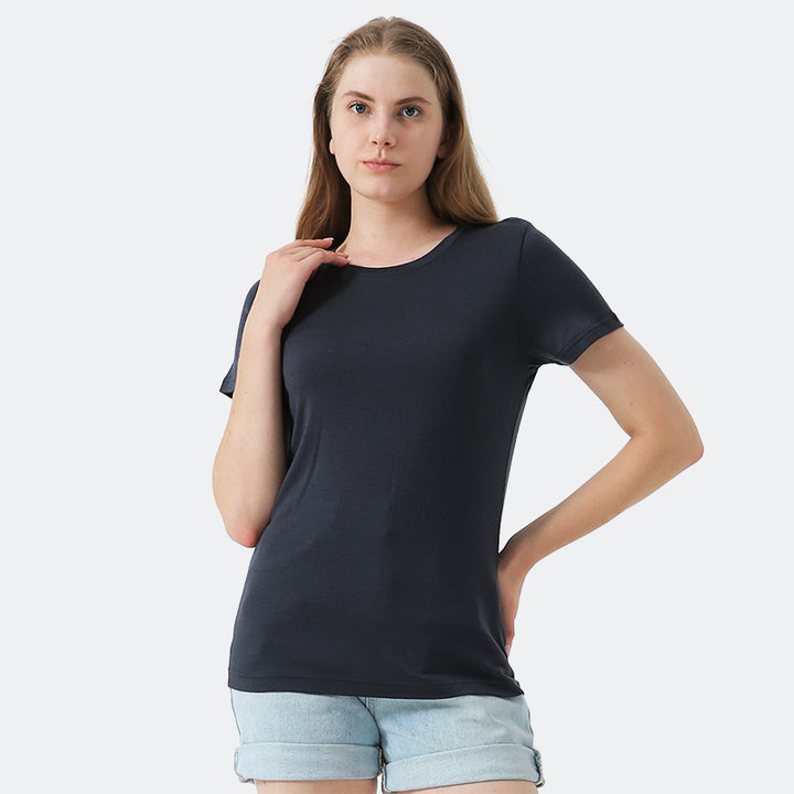 Famel model wearing a lightweight Merino wool short sleeve crew t-shirt, breathable and comfortable, shown in charcoal.
