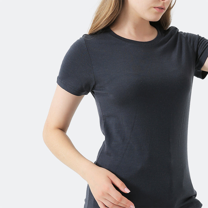 Famel model wearing a lightweight Merino wool short sleeve crew t-shirt, breathable and comfortable, shown in charcoal.
