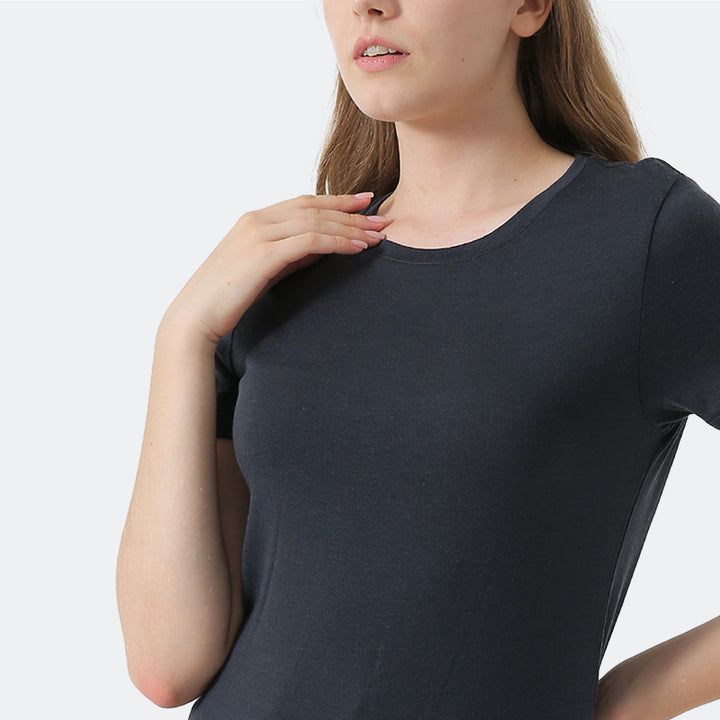 Famel model wearing a lightweight Merino wool short sleeve crew t-shirt, breathable and comfortable, shown in charcoal.