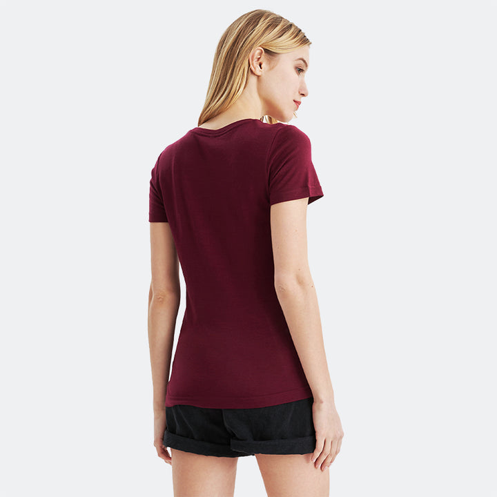 Famel model wearing a lightweight Merino wool short sleeve crew t-shirt, breathable and comfortable, shown in dark red.