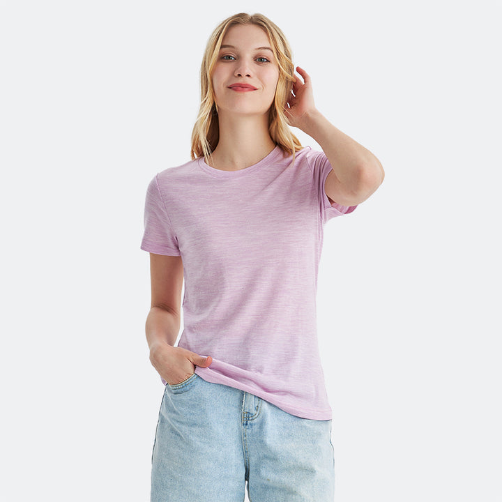 Famel model wearing a lightweight Merino wool short sleeve crew t-shirt, breathable and comfortable, shown in pink heather.