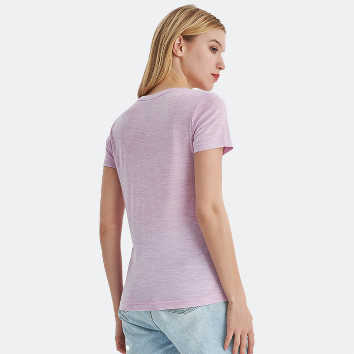 Famel model wearing a lightweight Merino wool short sleeve crew t-shirt, breathable and comfortable, shown in pink heather.