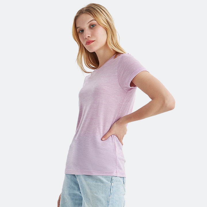 Famel model wearing a lightweight Merino wool short sleeve crew t-shirt, breathable and comfortable, shown in pink heather.