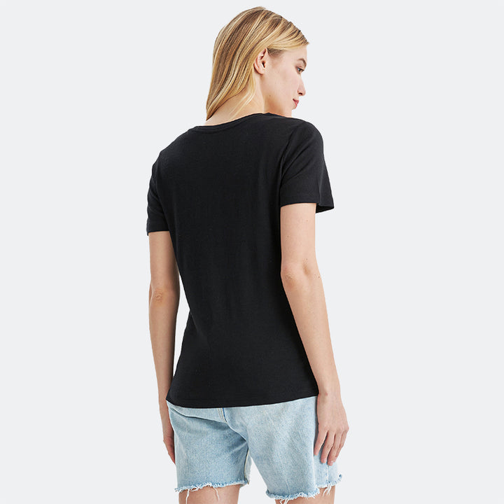 Famel model wearing a lightweight Merino wool short sleeve v-neck t-shirt, breathable and comfortable, shown in Black.
