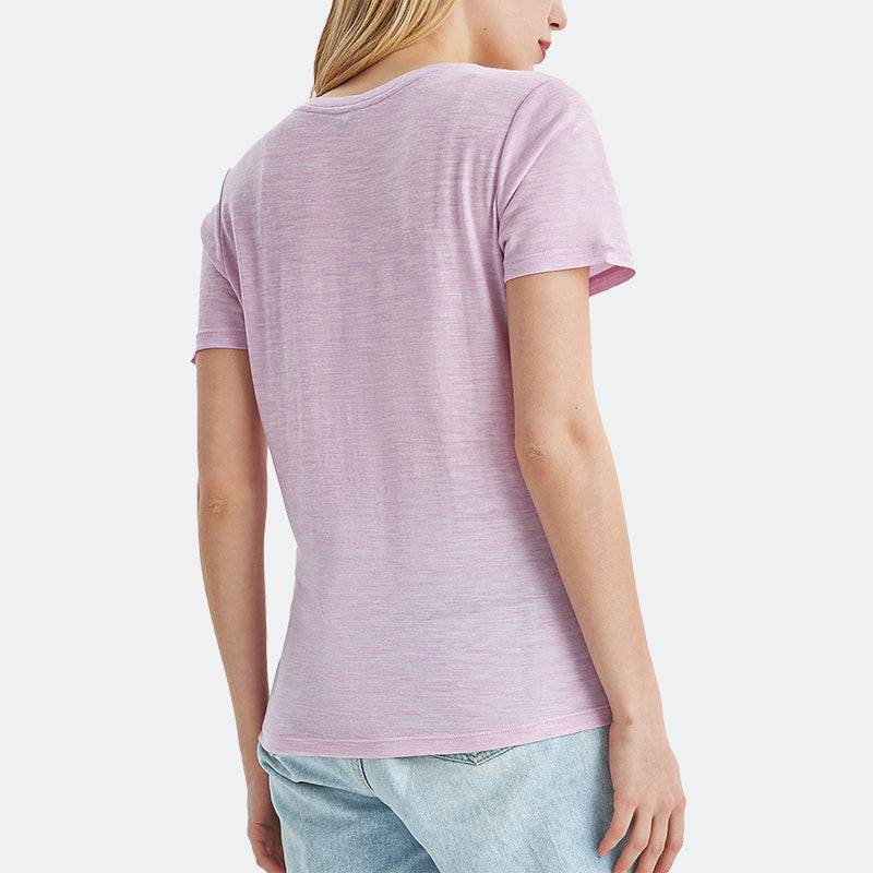 Famel model wearing a lightweight Merino wool short sleeve v-neck t-shirt, breathable and comfortable, shown in Pink Heather.