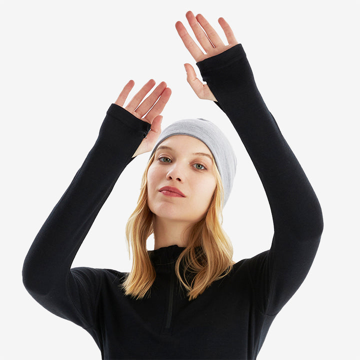 Famel  model wearing black Men’s 250g Merino wool long sleeve half zip top, breathable and moisture-wicking for warmth and outdoor comfort.