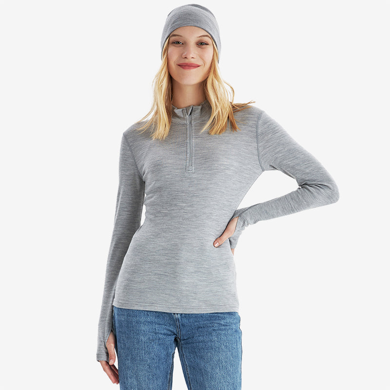 Famel  model wearing Light Grey Heather Men’s 250g Merino wool long sleeve half zip top, breathable and moisture-wicking for warmth and outdoor comfort.