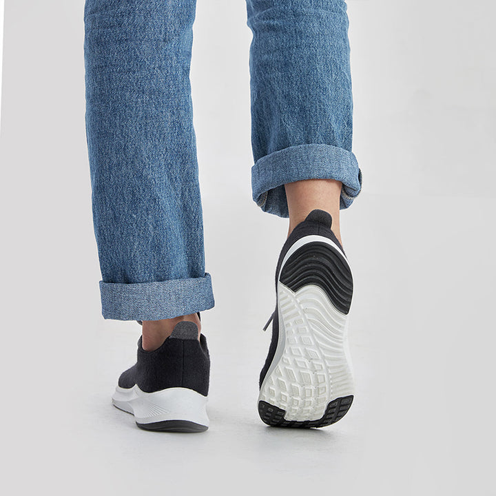 Dark grey women’s lace up shoes made with breathable Merino wool, lightweight and comfortable for everyday wear.